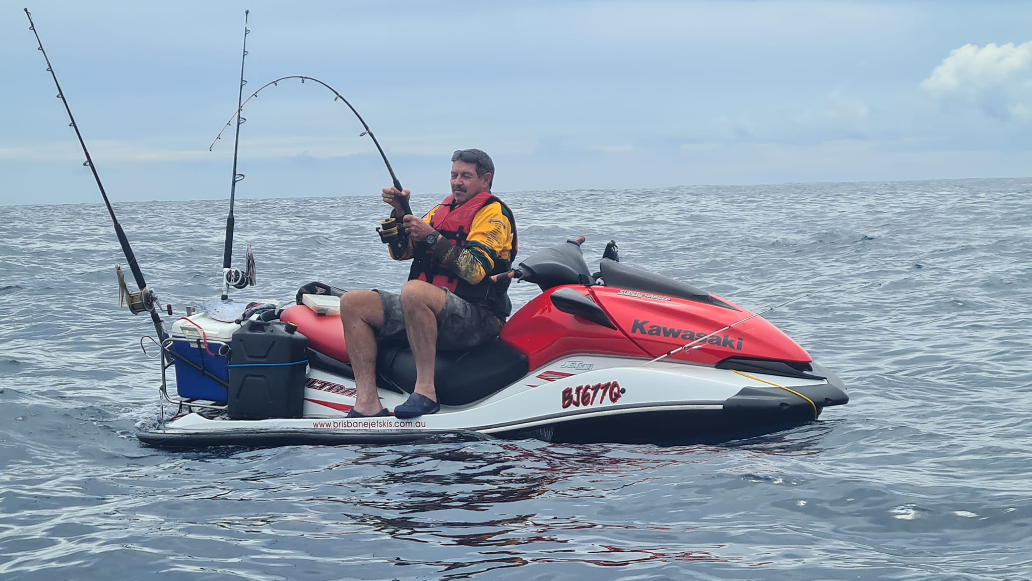 Red Kawasaki fishing setup on the water